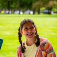 Student smiles while working during Student Small Business Market.